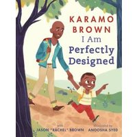 Children's book "I Am Perfectly Designed" with illustration of father and son walking on a path, trees in background.