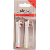 Idento Active Brush Head pack with two white brush heads, red and yellow color rings, in clear plastic packaging.