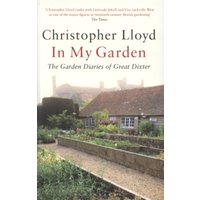 Paperback book "In My Garden" by Christopher Lloyd, featuring a garden scene with stone walls and a traditional house.