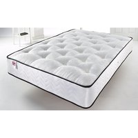 White king-size mattress with quilted top, black trim, and diamond pattern on sides, placed in a bright room.
