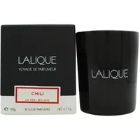Black Lalique Chili La Paz Bolivie candle in sleek holder beside matching black box with white and red label.