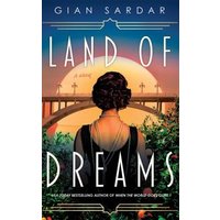 "Land of Dreams book cover featuring a woman in black dress, sunset, and bridge in background."
