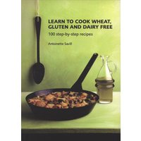 Cookbook titled "Learn to Cook Wheat, Gluten and Dairy Free" with skillet and oil bottle on green background.
