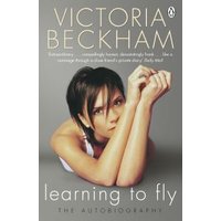 "Book 'Learning to Fly' by Victoria Beckham with cover showing woman resting chin on arms against gray background"