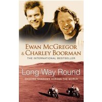 "Book 'Long Way Round' by Ewan McGregor and Charley Boorman, cover with portraits and desert landscape"