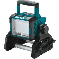 Makita cordless LED worklight with teal and black casing, square light panel, and sturdy handle on top.