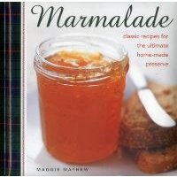 Jar of orange marmalade with metal lid, next to slices of bread, on a cookbook cover titled "Marmalade".