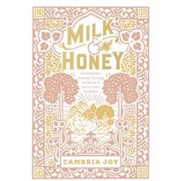 "Milk & Honey book with ornate floral design, gold and pink hues, by Cambria Joy, featuring mountains and trees."