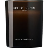 Black Molton Brown candle with "Orange & Bergamot" label, sleek glass container, and white text.