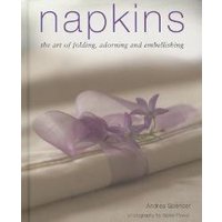Book titled "Napkins" with a folded white napkin adorned with a purple ribbon and flower on the cover.
