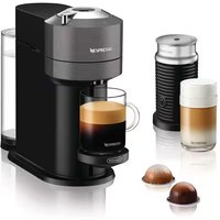 Grey Nespresso Vertuo Next coffee machine with Aeroccino milk frother, transparent water tank, and two coffee capsules.