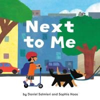 "Children's book 'Next to Me' with a child on a scooter and a dog on a leash against a colorful cityscape background"