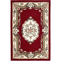 Red wool rug with floral border and central medallion design, featuring green, beige, and cream accents, 75 x 150cm.