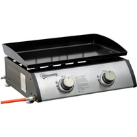 Portable gas plancha BBQ grill with two stainless steel burners, silver control panel, and black cooking surface.