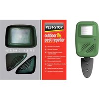 Green Pest-Stop ultrasonic pest repeller with solar panel and mounting stake, packaged with red and gray box.