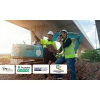 Two construction workers in safety gear at a site, one holding a clipboard, with machinery and bridge in the background.