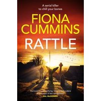"Rattle book cover by Fiona Cummins, featuring a sunset over a graveyard with silhouetted figures and gravestones."