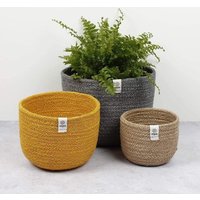 Set of three jute baskets in yellow, gray, and beige, each with a woven texture and Respiin label.