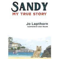 "Sandy My True Story book cover with a small dog on a beach, seaside village in background, by Jo Lapthorn."
