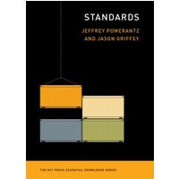 "Book titled 'Standards' with colorful shipping containers on black cover"