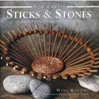 "Book titled 'Sticks and Stones' featuring a woven basket with wooden sticks and smooth gray stones on the cover"