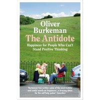 Paperback book titled "The Antidote" by Oliver Burkeman, featuring people sitting on a bench in a green park.
