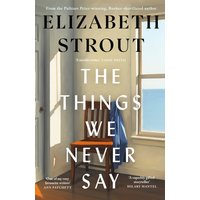 Paperback book "The Things We Never Say" by Penguin Books Ltd, cover showing a wooden chair by a window with a sea view.