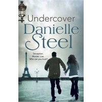 "Undercover book by Danielle Steel, cover with couple running towards Eiffel Tower under cloudy sky"