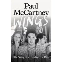 Black and white book cover titled "Wings" by Paul McCartney, featuring a group of people in the background.