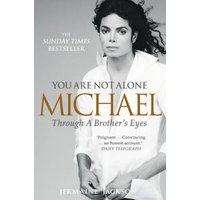 "You Are Not Alone" book with black and white photo of a man in white shirt, gold and white text on cover.