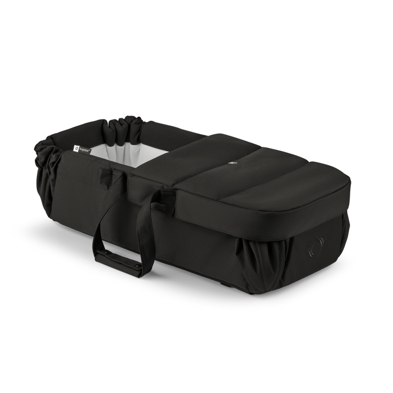Black Bugaboo Baby Nest featuring a soft, padded interior, adjustable drawstring top, and sturdy handles for easy transport, designed for comfort and safety for infants.
