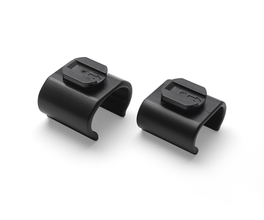 Black plastic Bugaboo parasol adapter set, featuring two curved clips with a secure locking mechanism for easy attachment to strollers, designed for the 2017 model.