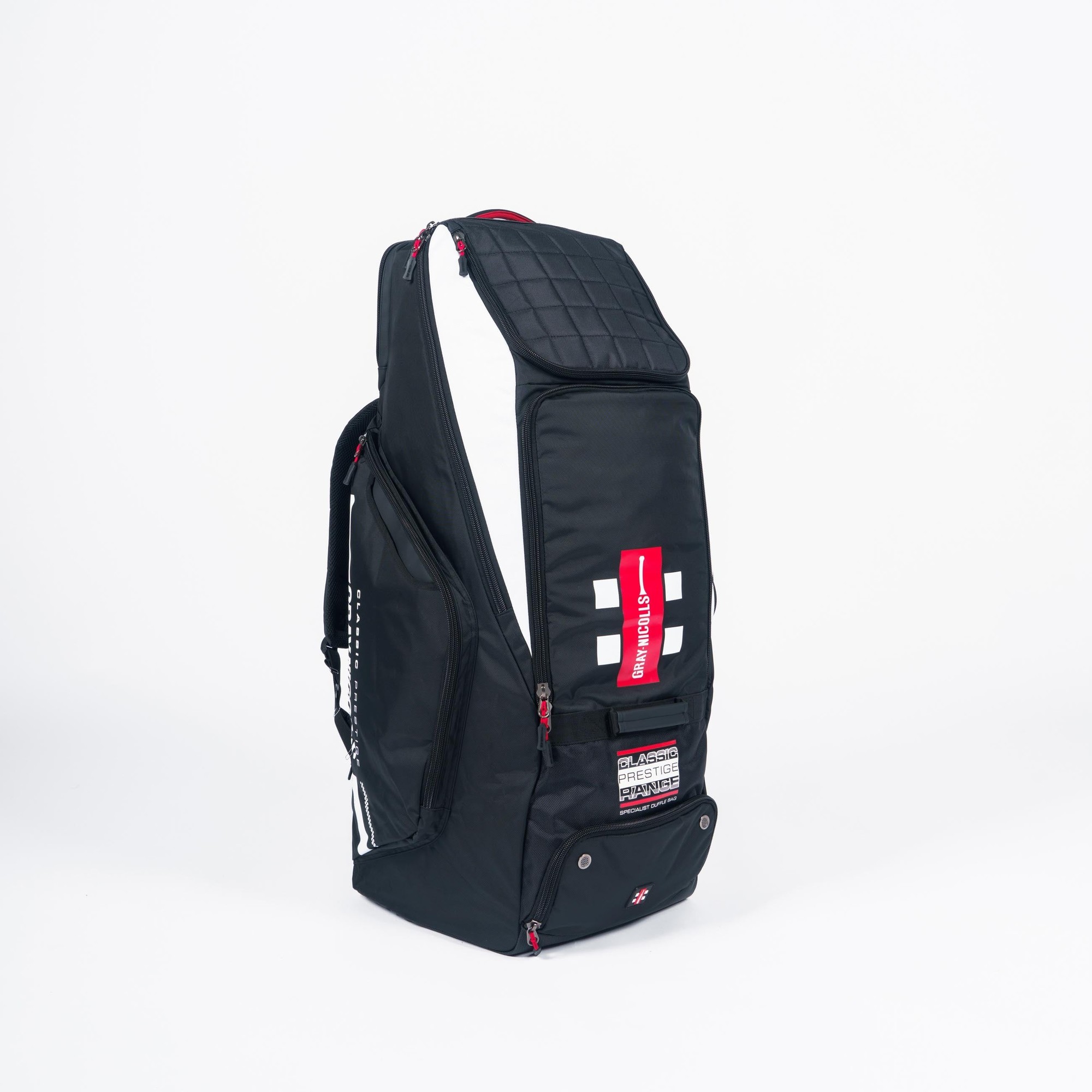 Black Gray-Nicolls Classic Prestige Duffle with a quilted top, red accents, multiple compartments, and a sturdy design, ideal for sports equipment and travel.