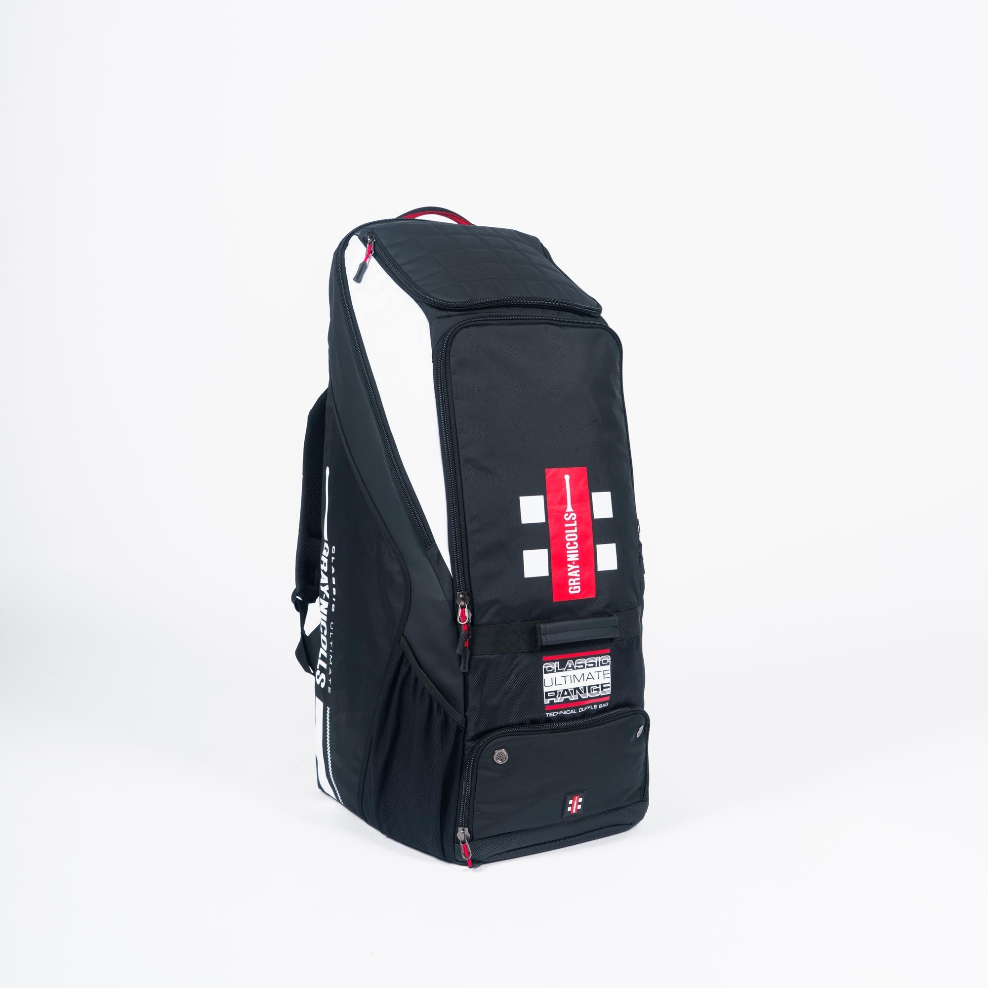 Gray-Nicolls Classic Ultimate Duffle Bag in black and white, featuring a spacious main compartment, sturdy zippers, and a bold red logo patch.