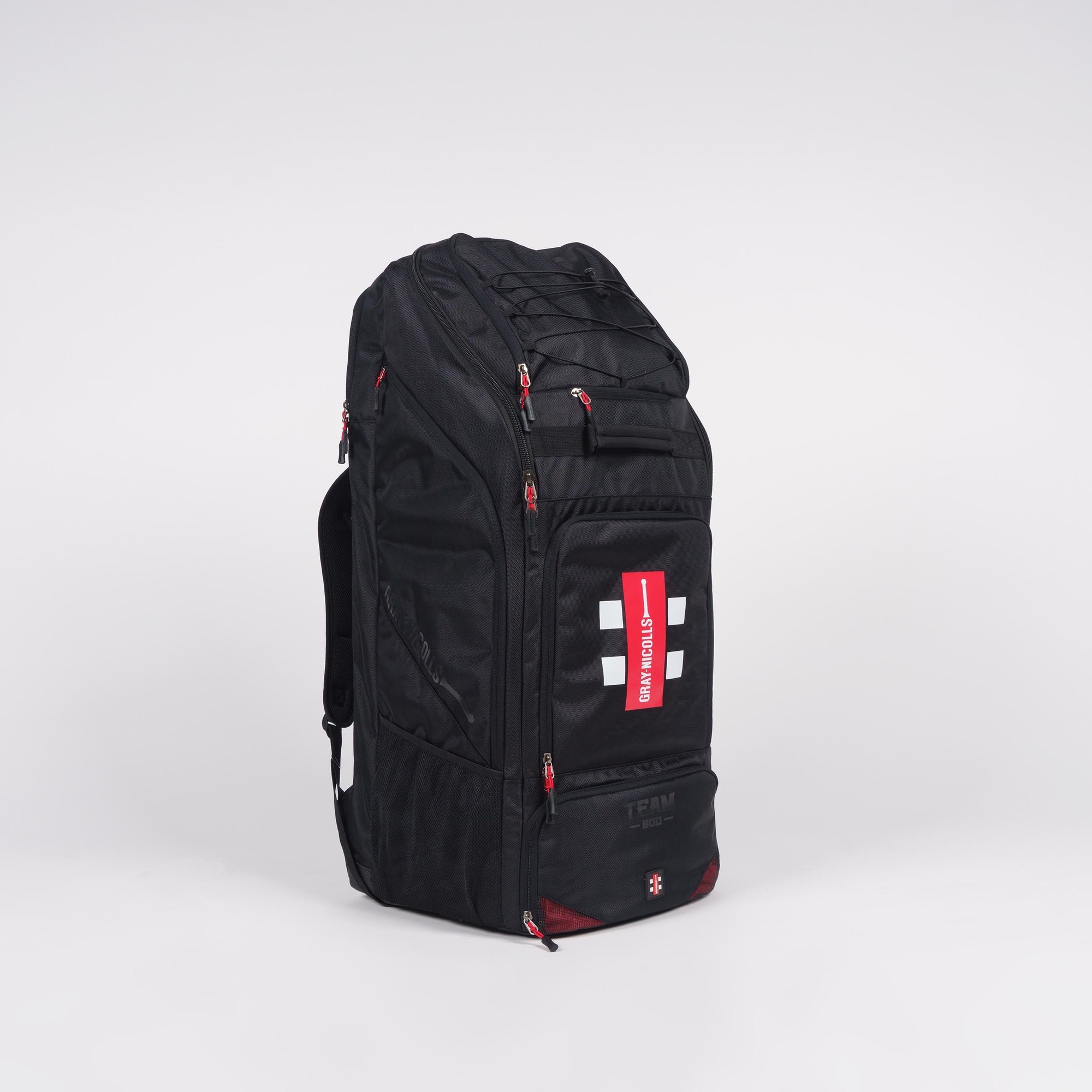 Black Gray-Nicolls Team 800 duffle bag featuring a spacious main compartment, multiple zippered pockets, and red accents, designed for sports and travel.