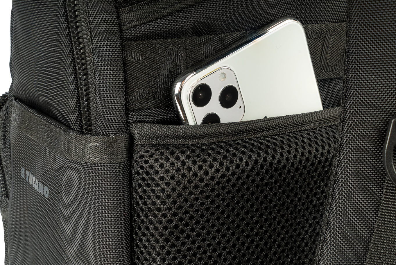 Black Tucano Terra Gravity Backpack featuring durable fabric, mesh pocket, and a visible smartphone peeking from the side pocket.