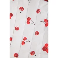 White makeup bag with red cherry print, featuring clusters of cherries on stems, by 24 Colours.