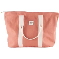 Pink organic canvas tote bag with white handles and a small front logo patch.