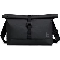 Black Got Bag messenger bag with roll-top closure, adjustable strap, and front buckle.