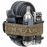 Black Topeak Elementa Strap with CO2 cartridge, multi-tool, and coiled bike tube secured by a tan strap with logo.