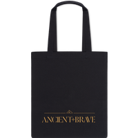 Black tote bag with long handles, featuring gold "ANCIENT+BRAVE" text on the front.