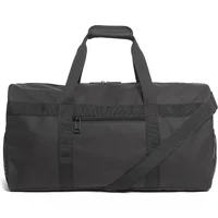 Black Lyle & Scott travel bag, weather-resistant, with dual handles, adjustable shoulder strap, and front zip pocket.