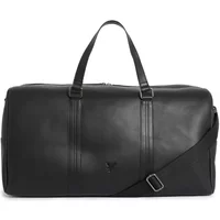 Black Lyle & Scott travel bag with dual handles, adjustable shoulder strap, and subtle logo on the front.