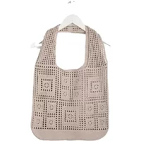 Beige crochet tote bag with square pattern and wide shoulder strap.