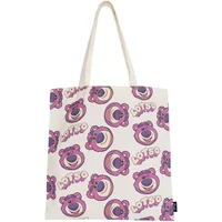 White tote bag with pink Lotso bear pattern from Toy Story, featuring smiling bear faces and "Lotso" text.