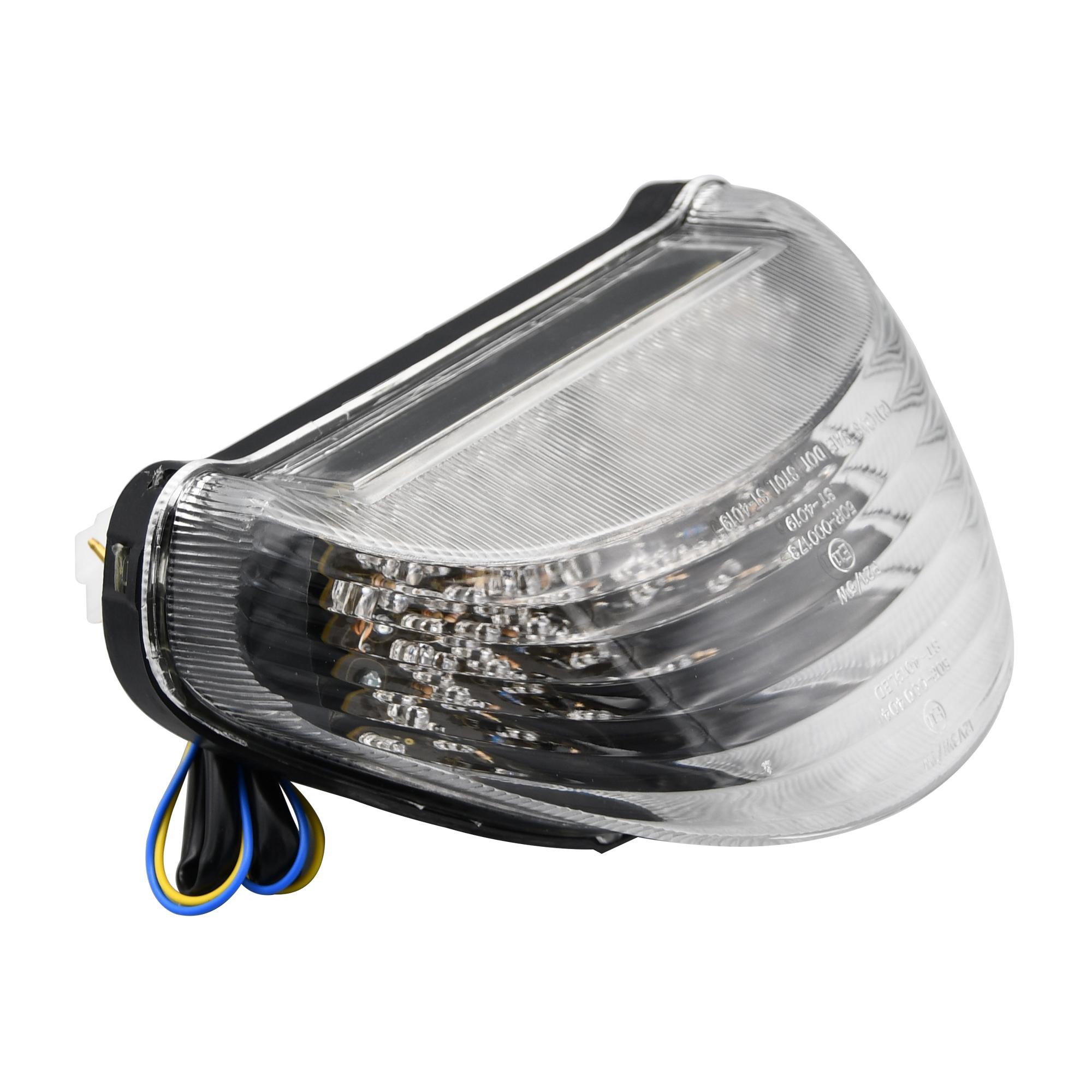 LED rear tail light with a clear lens, featuring integral indicators, designed for Kawasaki ZX-12R Ninja models from 1999 to 2006, with a sleek, modern shape and black housing.