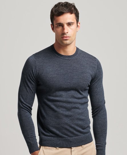 Navy blue Merino wool sweater by Superdry, featuring a classic crew neck, long sleeves, and a fitted silhouette, perfect for a stylish and comfortable look.