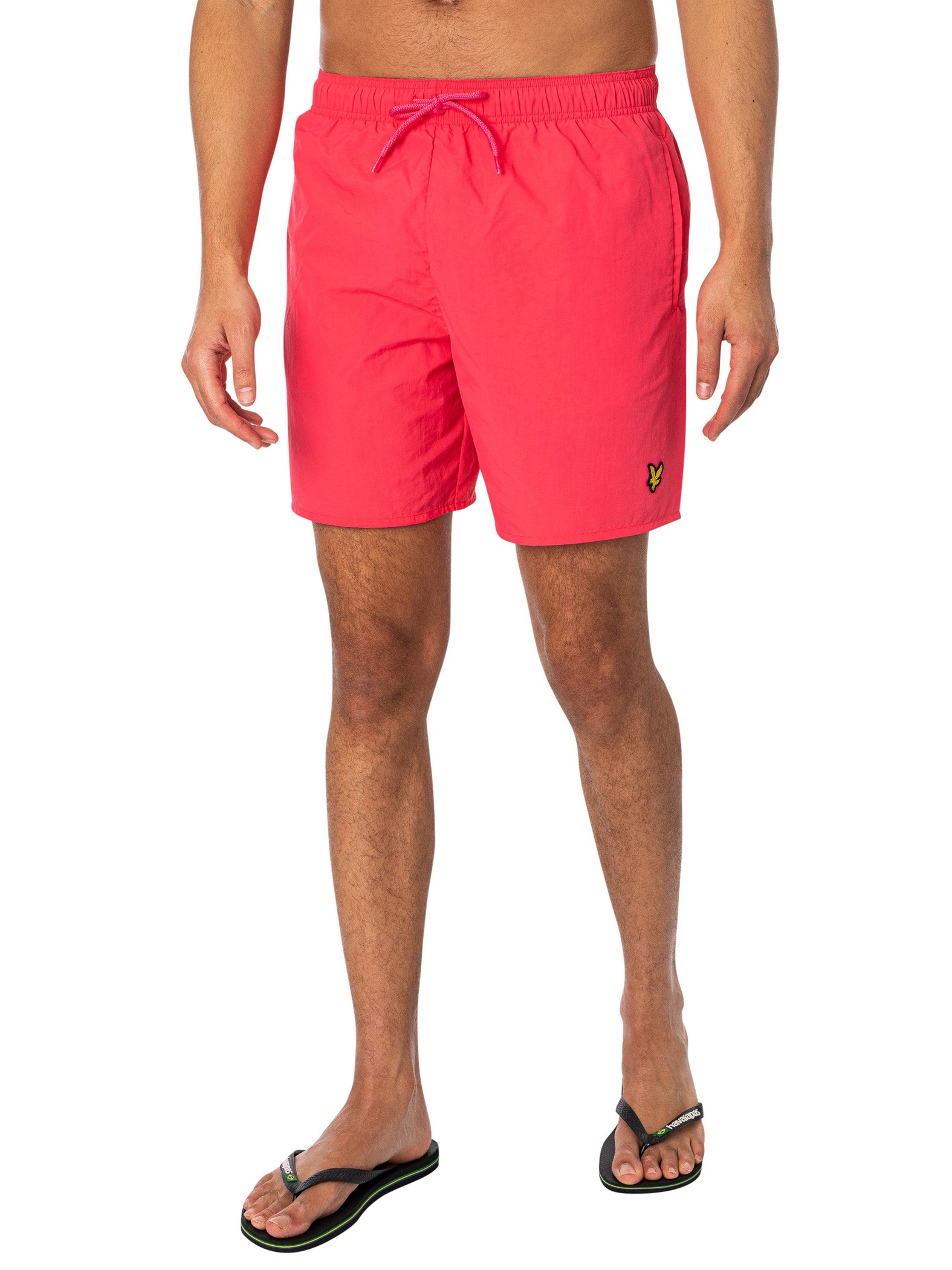 Plain pink sweater by Lyle & Scott, featuring a round neckline, long sleeves, and the brand's iconic logo embroidered on the chest.