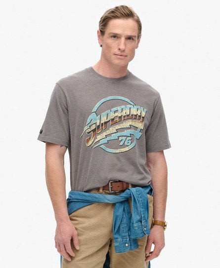 Navy and dark pebble grey Superdry Men's 70s Rock Graphic Band T-shirt featuring a retro-style graphic print and a relaxed fit, made from soft cotton material.
