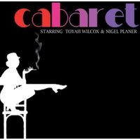 "Black 'Cabaret' vinyl record cover with colorful text and silhouette of person smoking on a chair"